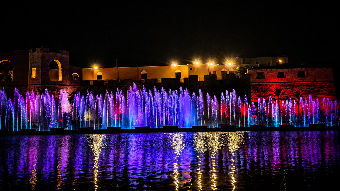 Large-scale musical fountain night show with synchronized water, lighting, and music effects