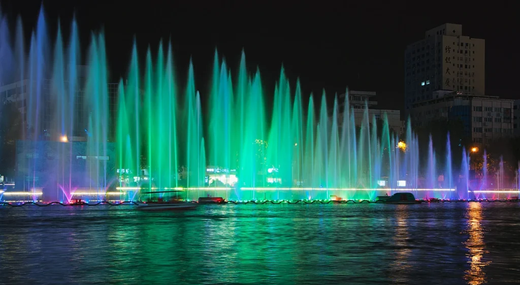 Night fountain scene with lighting and water surface reflection, showing how reflection can enhance fountain visual design.