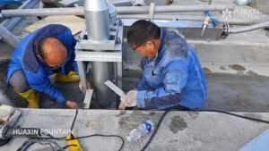 Huaxin team installing fountain equipment at Al-Saraya Al-Hamra Lake