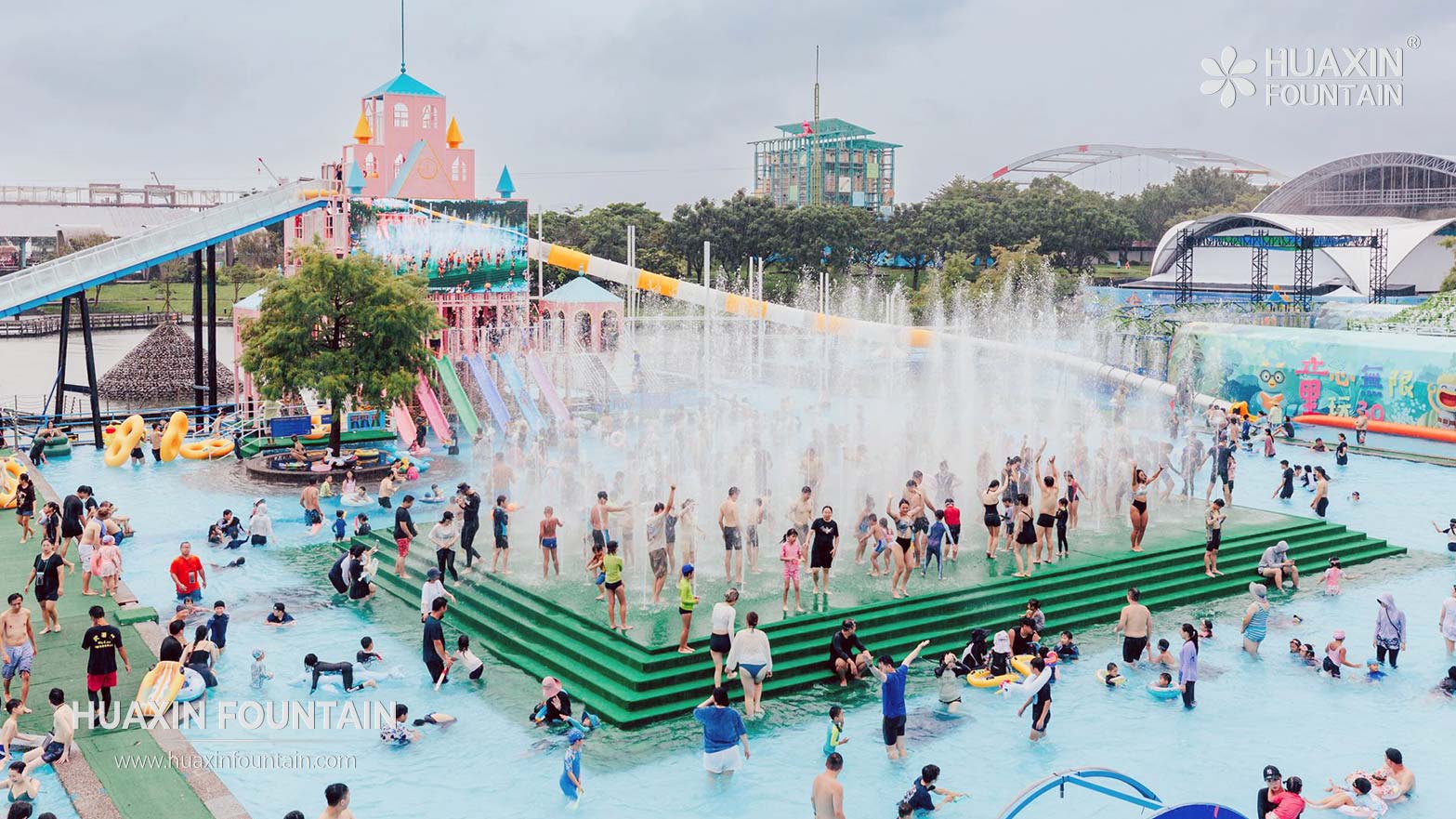 Dry deck fountain with ground-level water jets integrated into a walkable plaza surface