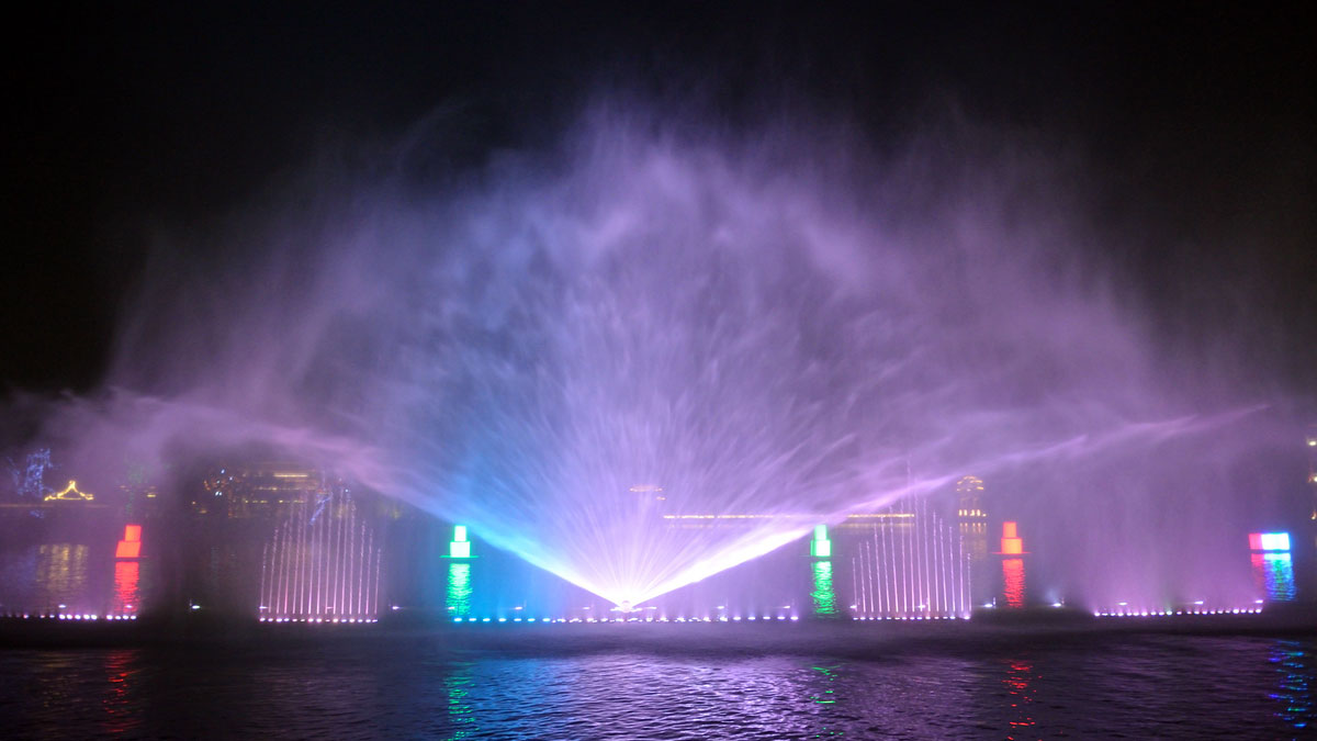 Outdoor water screen projection displaying visual content on a fountain water surface
