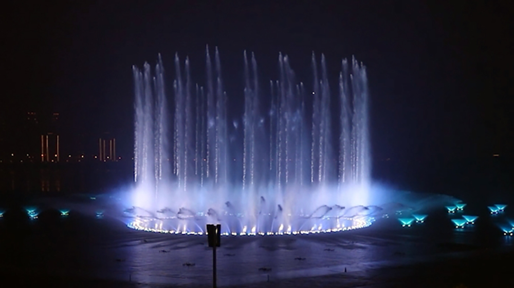 Compressed-air water burst in a musical fountain show