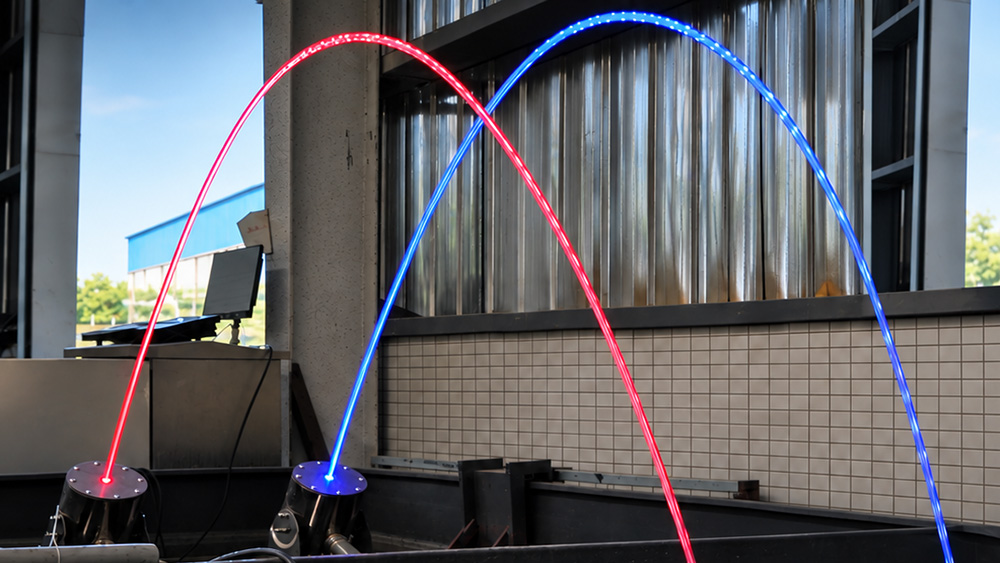 Laminar water arc with laser illumination during a Huaxin comparison test