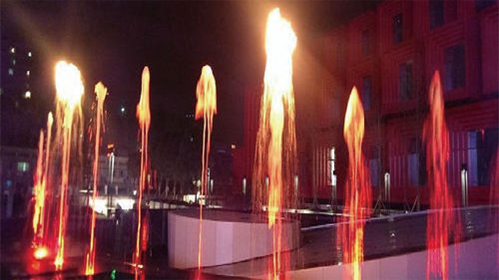 Water and fire fountain effect created by a Huaxin water and flame fusion jet